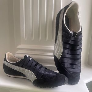 Women’s Puma black slip-on sneakers